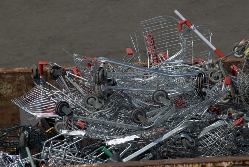 A tangle of abandoned and crushed supermarket shopping trollies