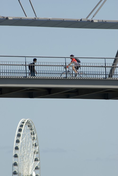 Pedestrians and Cyclists crossing a bridge